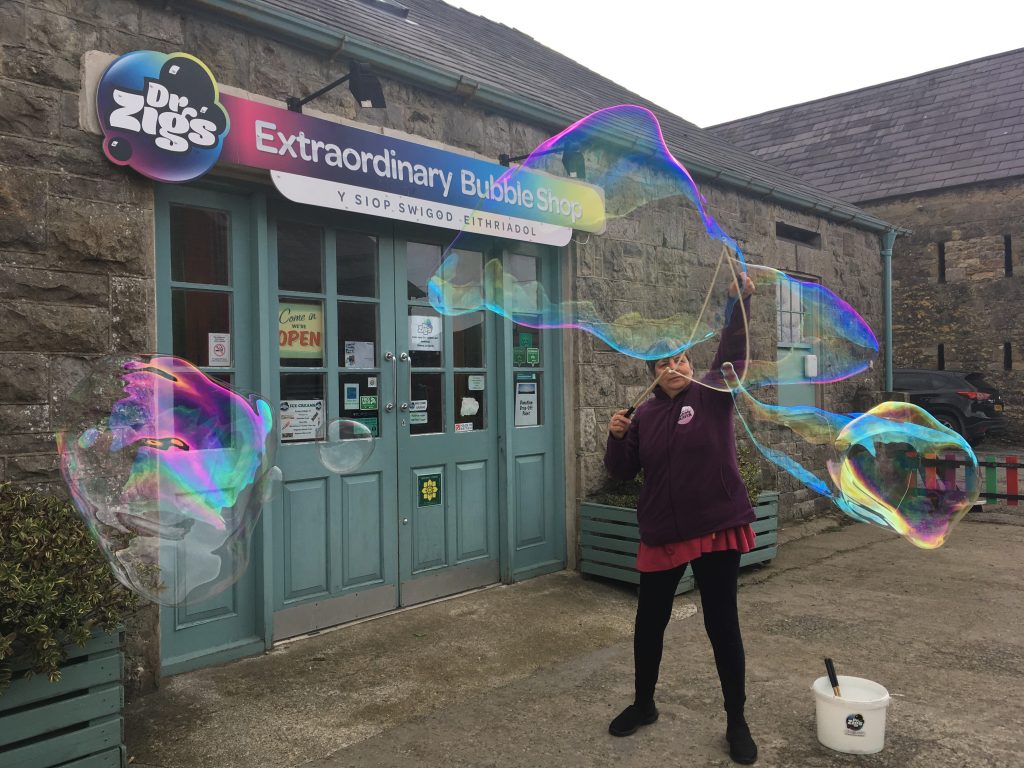 Making giant bubbles with Dr Zigs Tri String bubble wand and giant bubble juice.