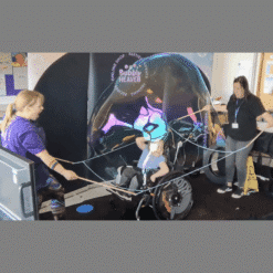 Giant bubble wand to put a big bubble dome over a child in a wheel chair