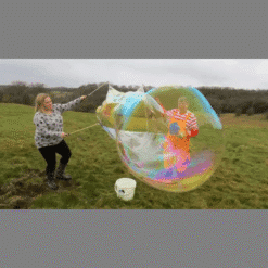 KIB kid inside a bubble wand used outdoors for massive bubbles