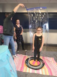 Kid inside a bubble at a party in Bristol. children's party entertainer. children's party entertainer.