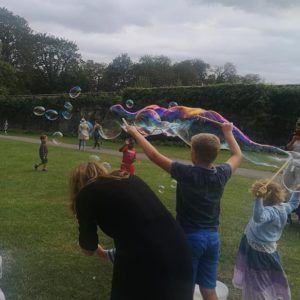 Giant bubble wand kit. Kids making big bubbles.