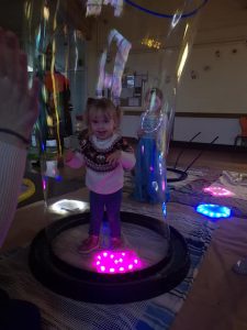 glow bubble kid inside bubble sensory entertainer. children's party entertainer.