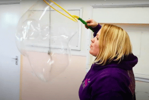 cheryl blowing bubbles inside bubbles entertainer training