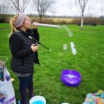 showing how to blow smoke bubbles