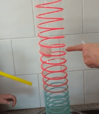blowing bubbles playing with a slinky toy