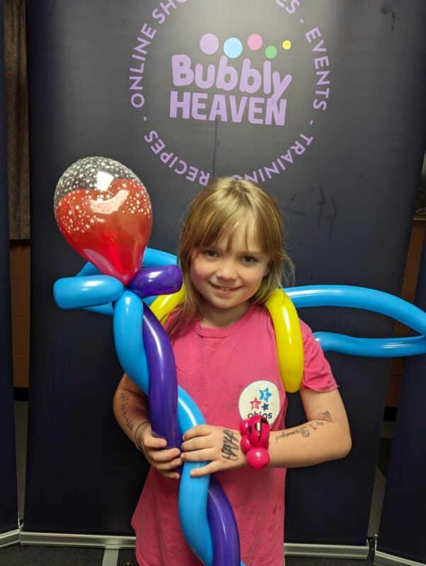 kids wearing balloon models