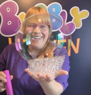 holding giant bubbles on hands sensory indoor bubble play