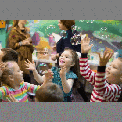 kids playing and popping bubbles
