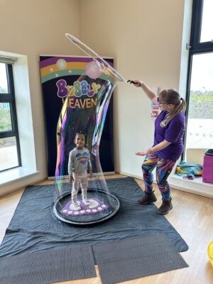 Kid inside a bubble activity bubble show entertainment workshops kids parties