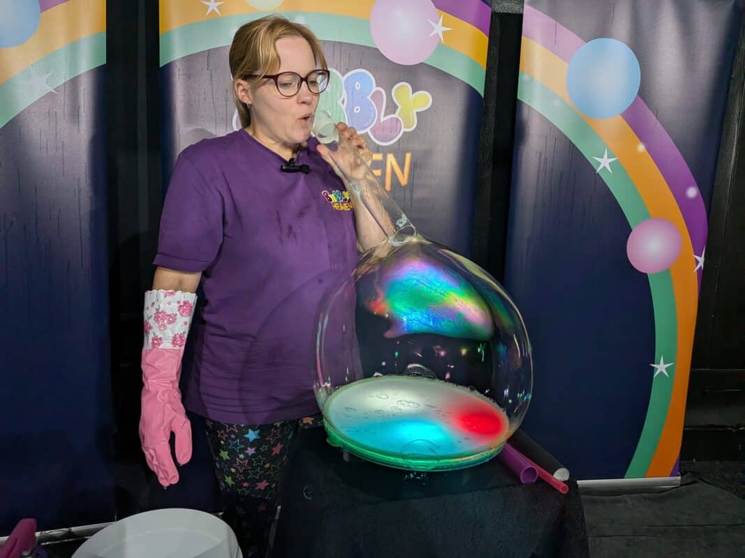 Bubble act teaching how to make bubble tricks on a light table