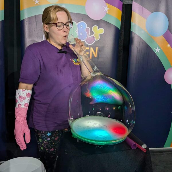 Bubble act teaching how to make bubble tricks on a light table