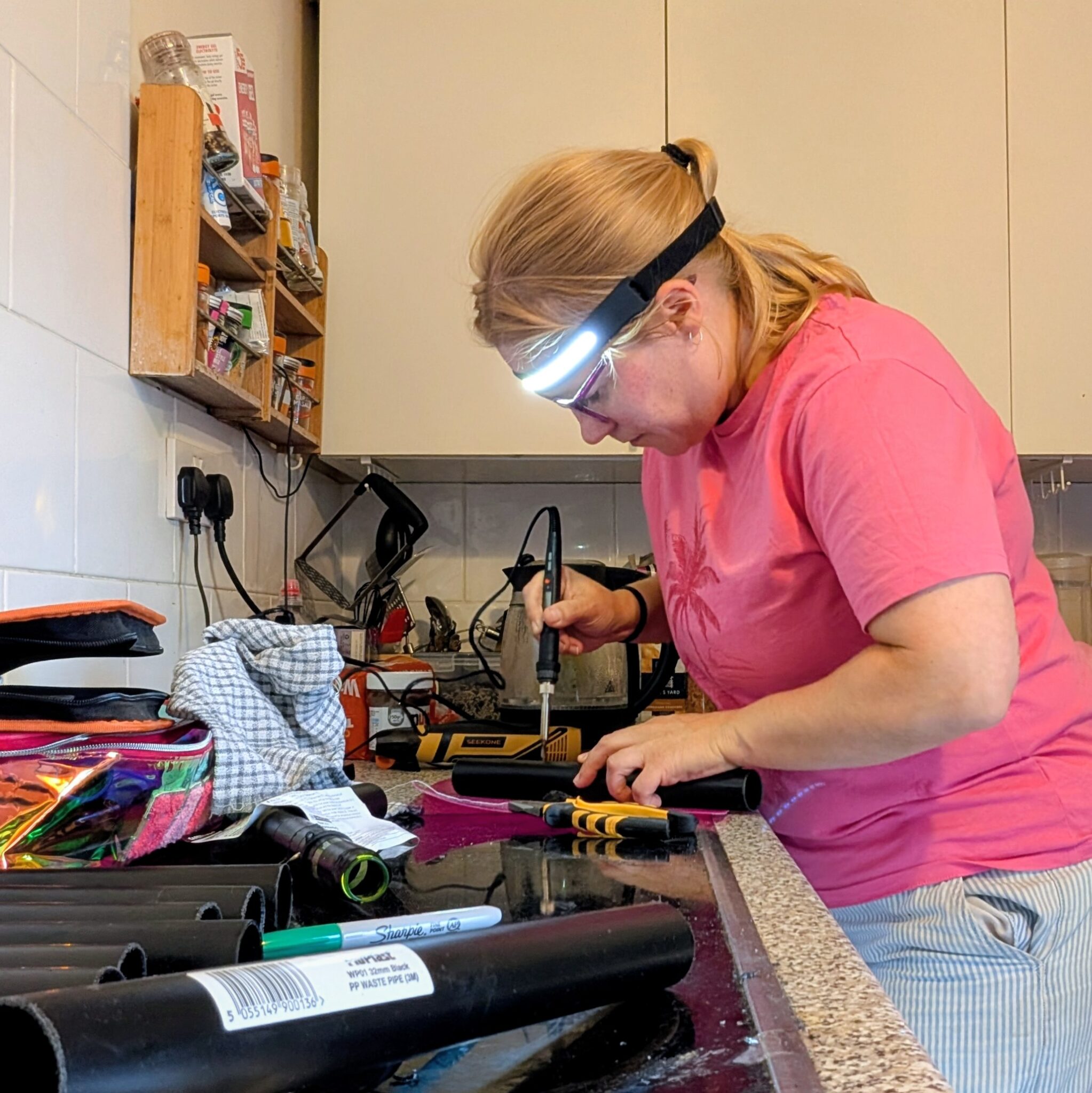 Prop maker making smoke bubble tube kits